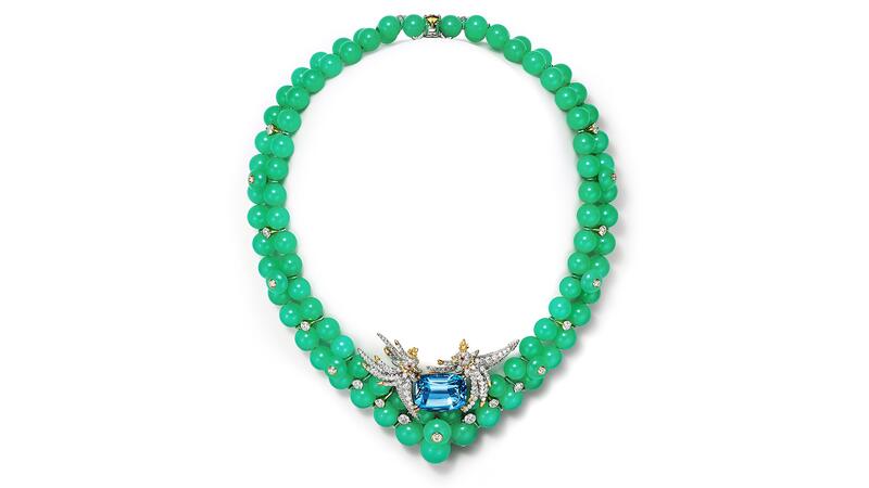 The “Bird on a Rock” necklace with chrysoprase beads features two platinum and 18-karat yellow gold birds with round ruby eyes on a 22.60-carat, cushion-cut, Santa Maria-hued Brazilian aquamarine. The birds and their aquamarine perch detach to become a brooch (price upon request) Tiffany & Co. Blue Book 2026: Hidden Garden Bird on a Rock Aquamarine and Chrysoprase Necklace
